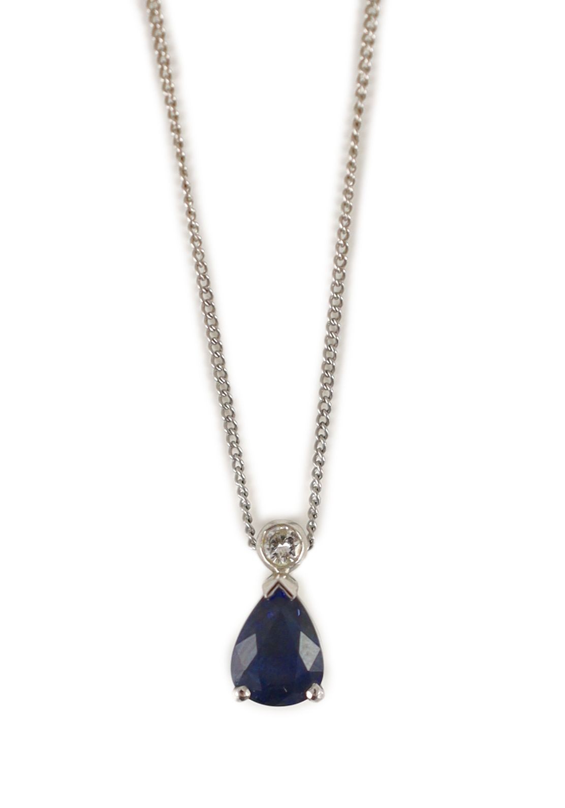 A platinum, pear shaped sapphire and single stone diamond set pendant necklace